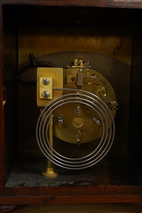 A mahogany mantel clock, retailed by J. W. Benson, c.1930, with engraved silvered dial, with key, 27cm high. Condition - good, untested